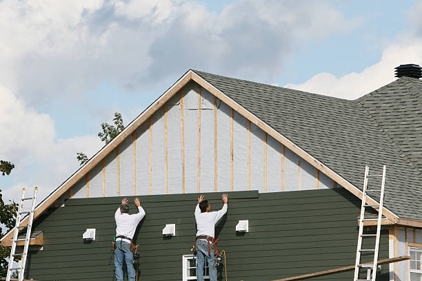 Professional Siding technician working in Riverside, NY
